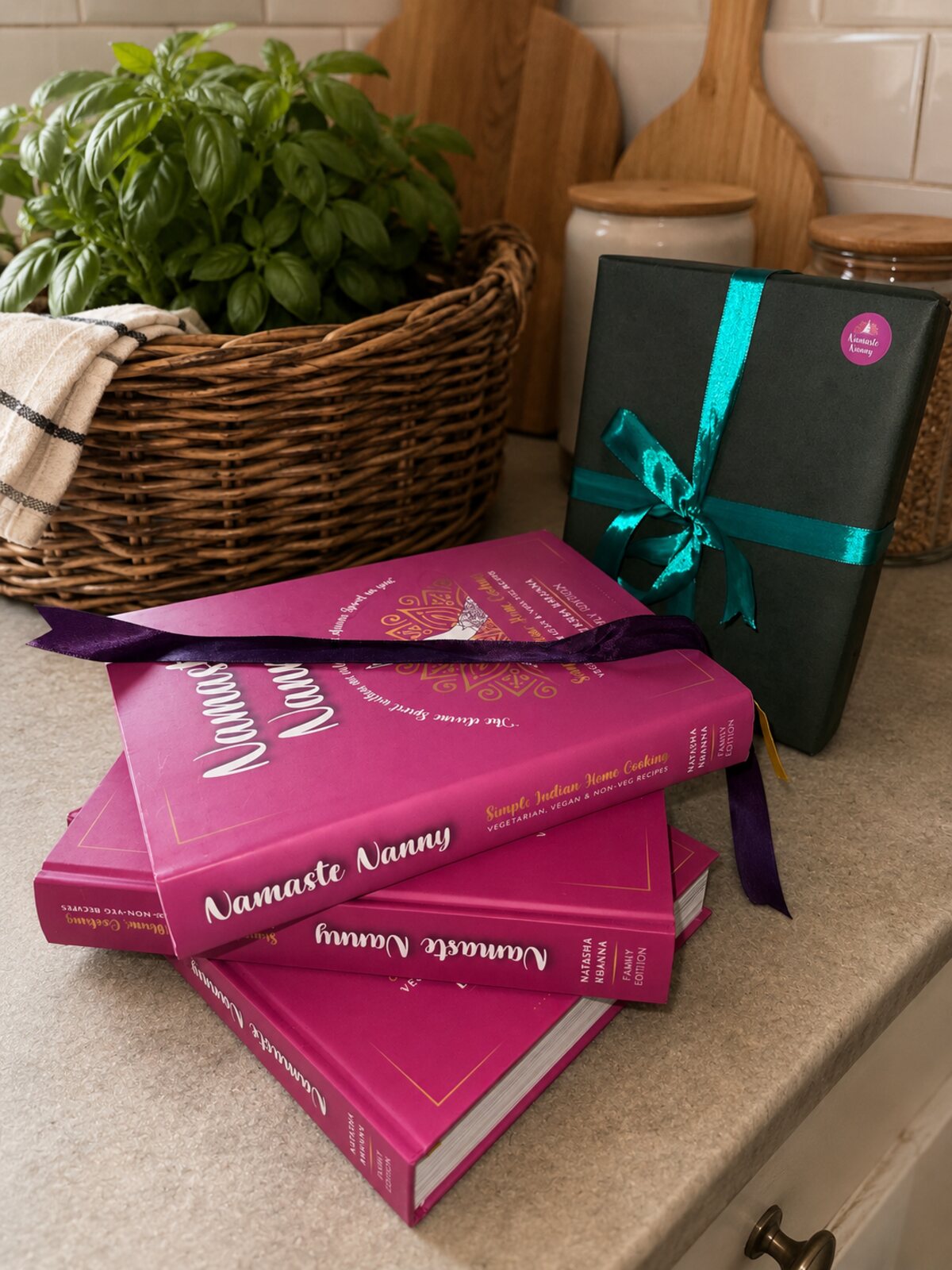A stack of Namaste Nanny books beside a gift-wrapped copy